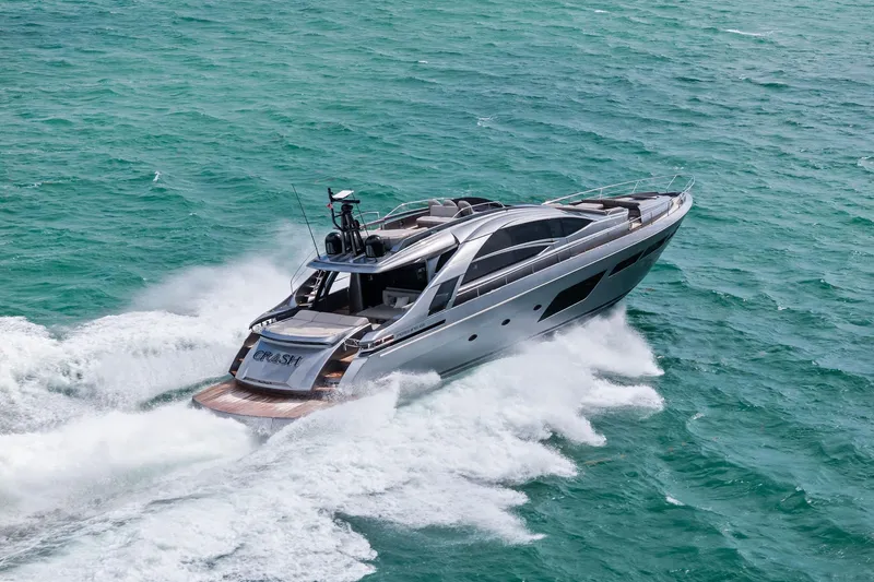 Slide: The Image of 2021 Pershing 8X yacht cruising on turquoise ocean waters. - 10