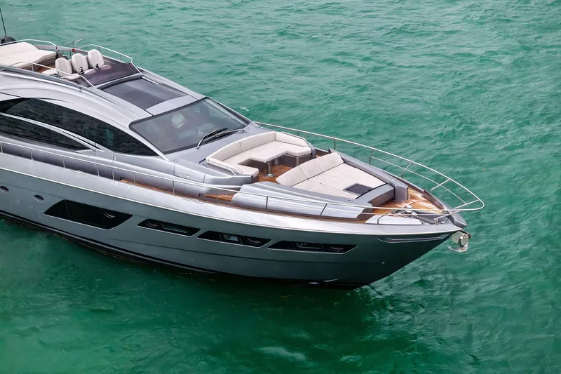 Slide: The Image of Luxury Pershing 8X yacht from 2021 on turquoise water, showcasing sleek design. - 11