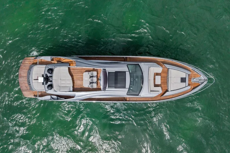 Slide: The Image of Aerial view of 2021 Pershing 8X yacht on green water. - 13