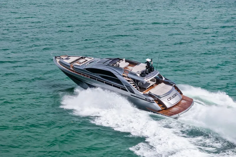 Slide: The Image of Luxury 2021 Pershing 8X yacht cruising on open sea, showcasing sleek design and elegance. - 14