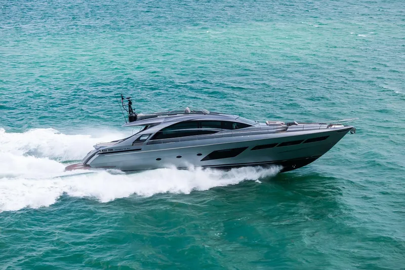 Slide: The Image of Luxury 2021 Pershing 8X yacht cruising on turquoise ocean waters. - 15