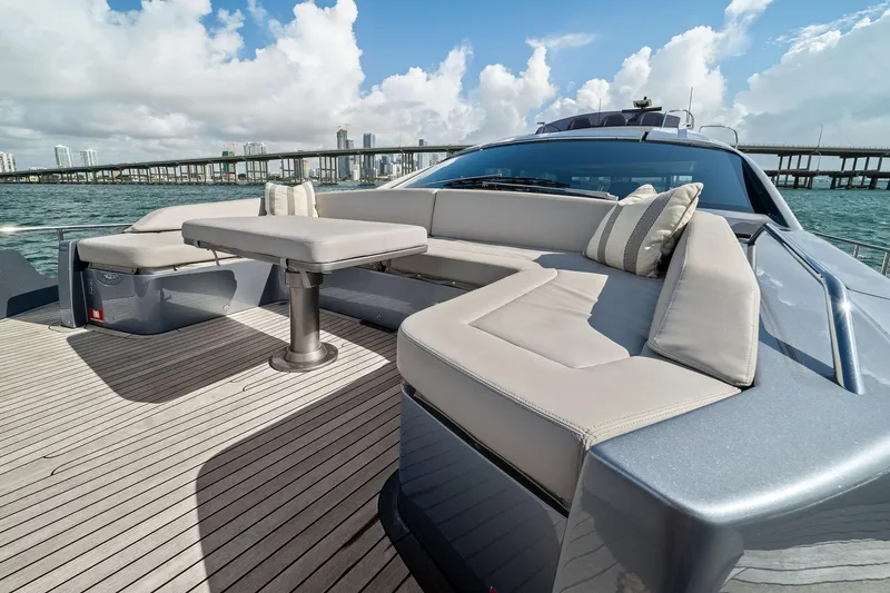 Slide: The Image of Luxurious 2021 Pershing 8X yacht deck with elegant seating and ocean view. - 17
