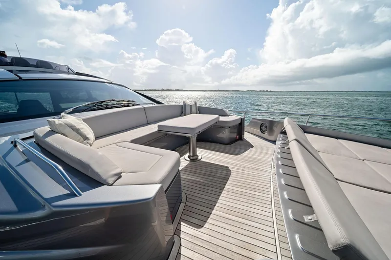 Slide: The Image of Luxurious 2021 Pershing 8X yacht deck with elegant seating and ocean view. - 18