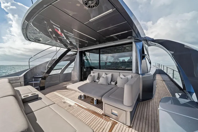 Slide: The Image of Luxurious 2021 Pershing 8X yacht deck with modern seating and sleek design. - 20