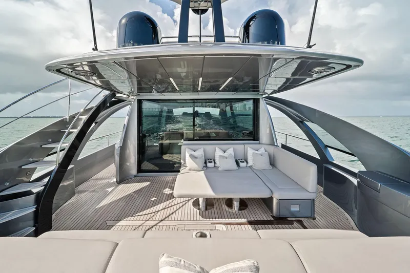 Slide: The Image of Luxurious 2021 Pershing 8X yacht deck with modern seating and ocean view. - 22