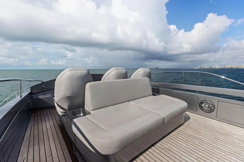 Slide: The Image of Luxury seating on 2021 Pershing 8X yacht deck, overlooking ocean and skyline. - 25