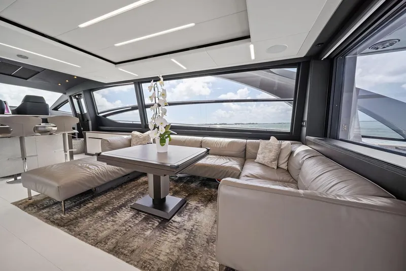 Slide: The Image of Luxurious interior of 2021 Pershing 8X yacht with modern seating and ocean view. - 28