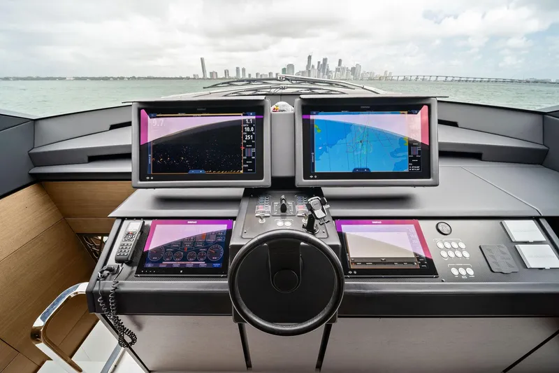 Slide: The Image of Cockpit of 2021 Pershing 8X yacht with advanced navigation displays and controls. - 31
