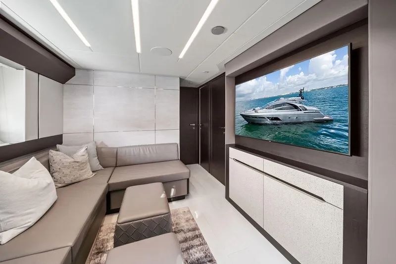 Slide: The Image of Luxurious interior of 2021 Pershing 8X yacht with modern seating and large TV display. - 36