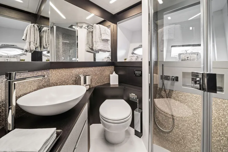 Slide: The Image of Luxurious bathroom in a 2021 Pershing 8X yacht, featuring modern fixtures and elegant design. - 39