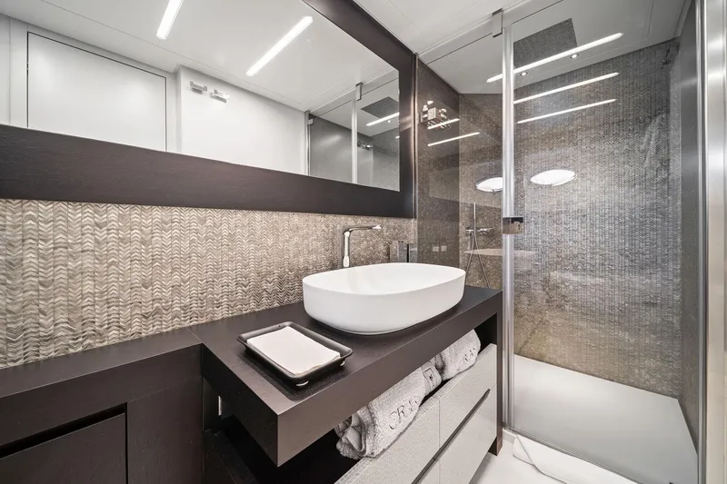 Slide: The Image of Luxurious bathroom in 2021 Pershing 8X yacht with modern sink and glass shower. - 40