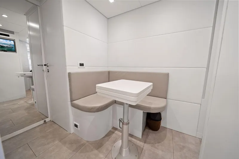 Slide: The Image of Modern interior of 2021 Pershing 8X yacht with sleek seating and table. - 41