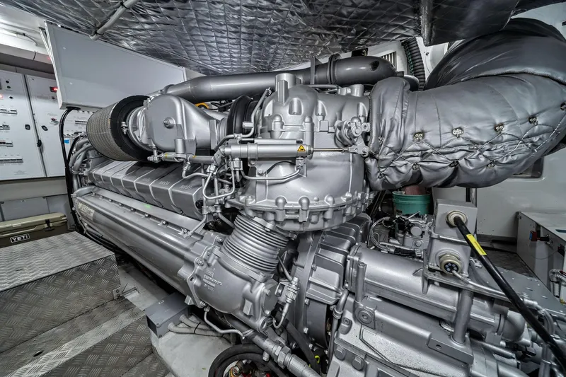 Slide: The Image of Engine room of a 2021 Pershing 8X yacht, showcasing advanced machinery and components. - 44