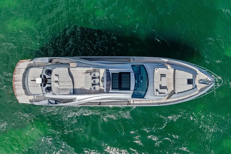 Slide: The Image of Aerial view of 2021 Pershing 8X yacht on vibrant green water. - 5
