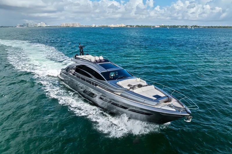 Slide: The Image of Luxurious 2021 Pershing 8X yacht cruising on clear blue ocean waters. - 6