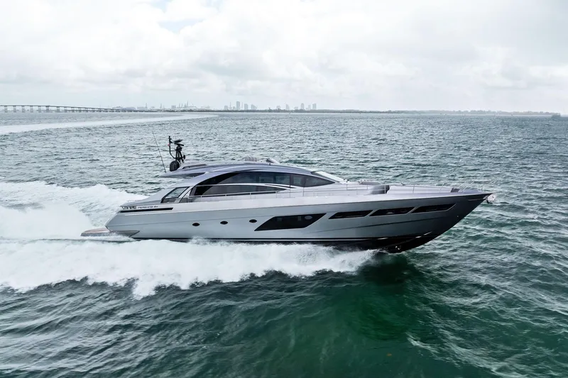 Slide: The Image of 2021 Pershing 8X yacht cruising on open water under cloudy skies. - 7