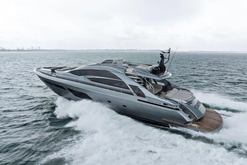 Slide: The Image of Luxury 2021 Pershing 8X yacht cruising on open water. - 8