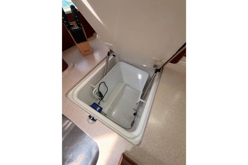 Slide: The Image of Open storage compartment in 2005 Beneteau Oceanis Clipper 423 yacht kitchen. - 42