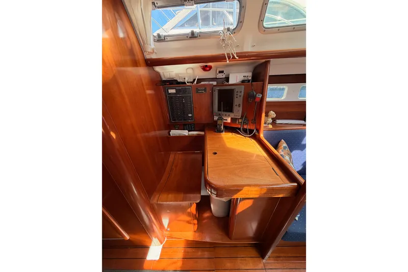 Slide: The Image of 2005 Beneteau Oceanis Clipper 423 navigation station with wood finish and electronics. - 54