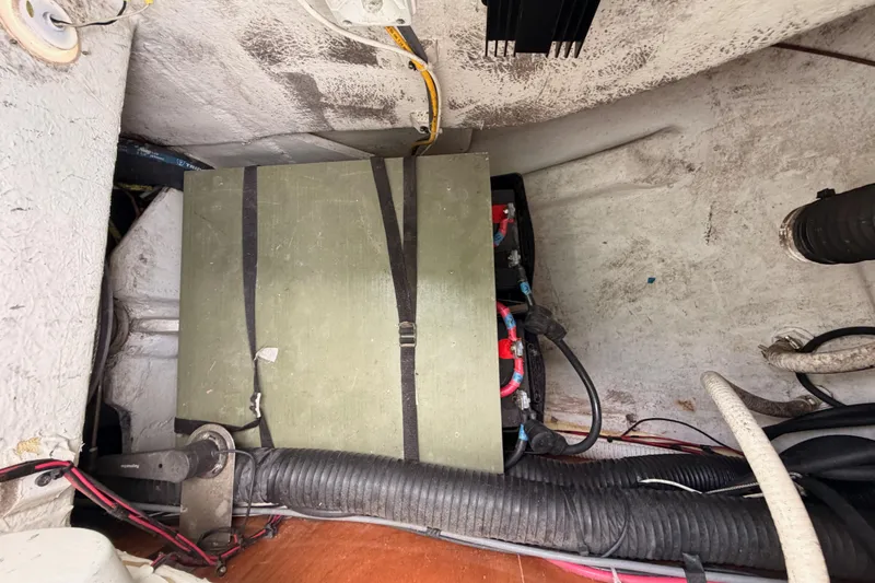 Slide: The Image of Battery compartment of a 2005 Beneteau Oceanis Clipper 423 sailboat, showing wiring and components. - 76