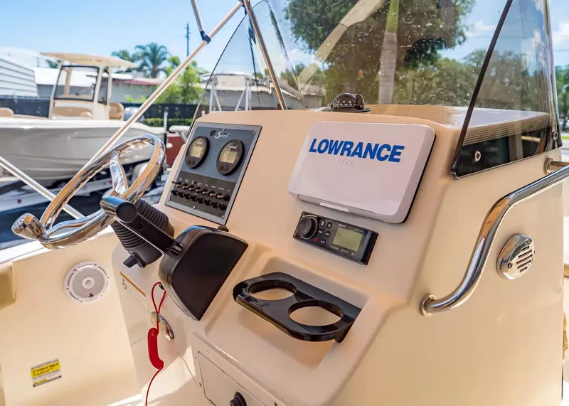 Slide: The Image of 2022 Scout 195 Sportfish helm with Lowrance device. - 11