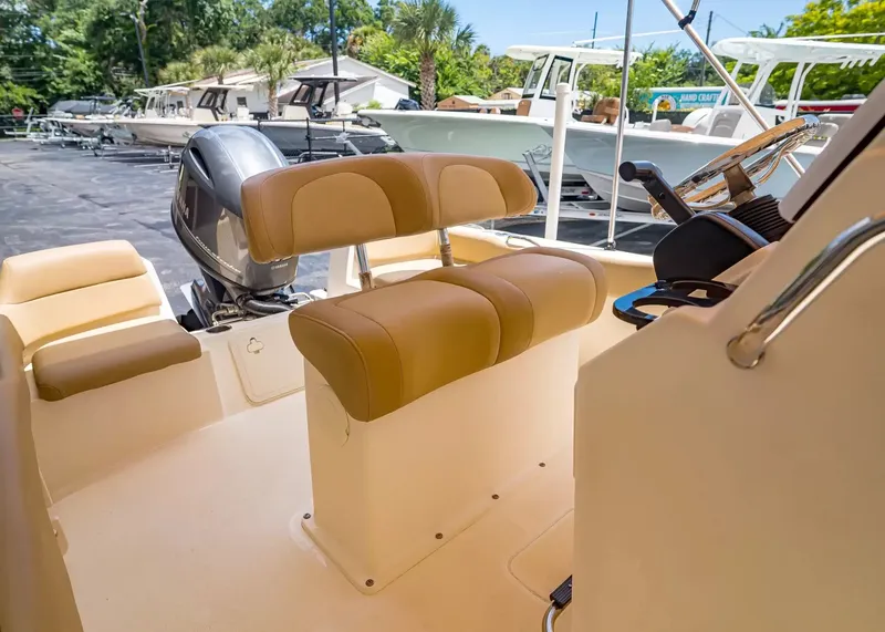 Slide: The Image of Interior view of a 2022 Scout 195 Sportfish boat with helm station. - 15