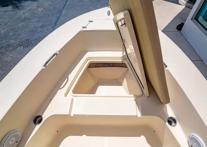 Slide: The Image of Scout 195 Sportfish 2022 with open storage compartment lid. - 18
