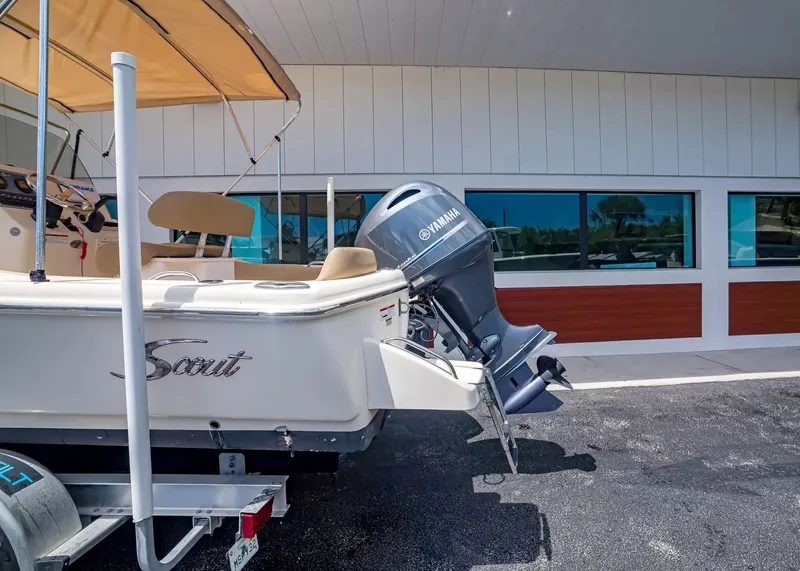 Slide: The Image of 2022 Scout 195 Sportfish with Yamaha engine, parked side view. - 3