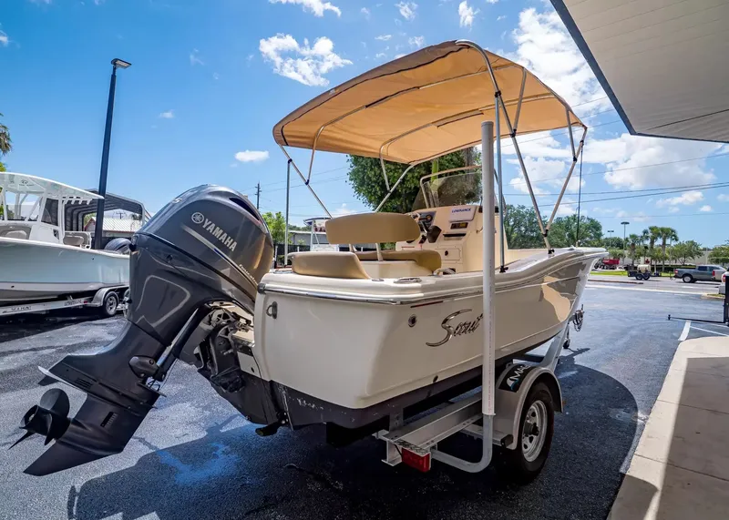 Slide: The Image of Scout 195 Sportfish 2022 with Yamaha engine, parked on a trailer. - 5