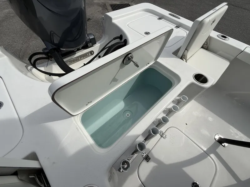 Slide: The Image of Sea Pro 230 Bay 2026 with YAMAHA 200 engine, open storage compartment. - 8