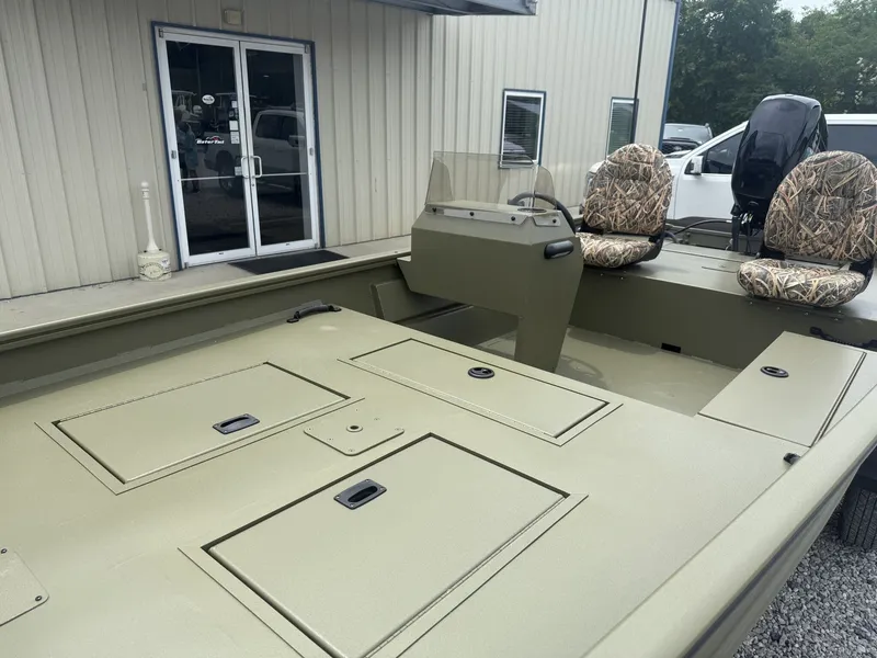 Slide: The Image of 2026 Lowe Roughneck 1650SC with camo seats and storage compartments. - 5
