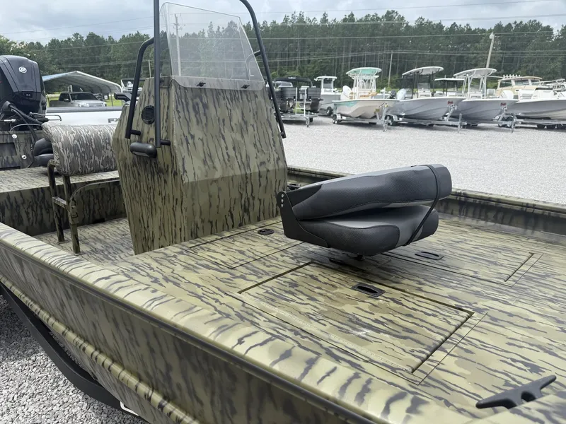 Slide: The Image of 2026 Lowe Roughneck 1760 Pathfinder with camouflage design outdoors. - 7