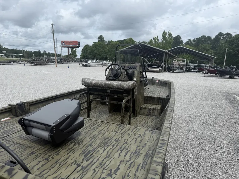 Slide: The Image of Lowe Roughneck 1760 Pathfinder 2026 outdoors on gravel lot. - 8