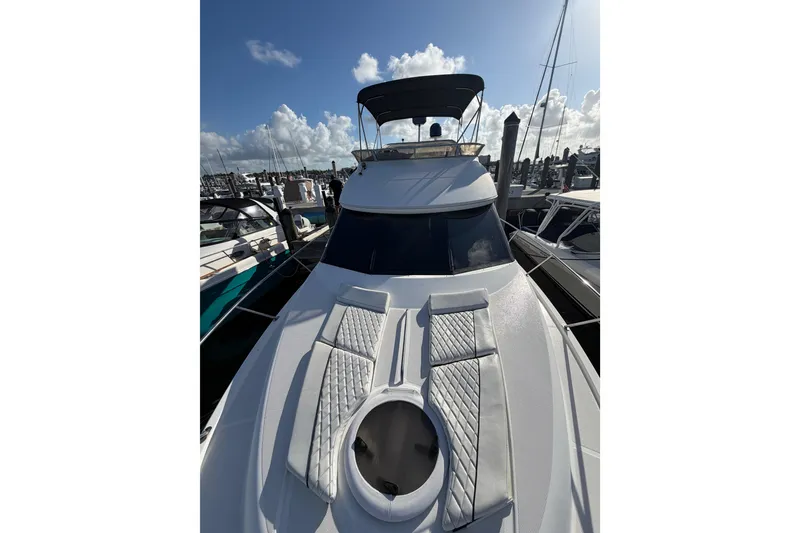 Slide: The Image of 2006 Meridian 341 Sedan yacht docked at marina under clear blue sky. - 11