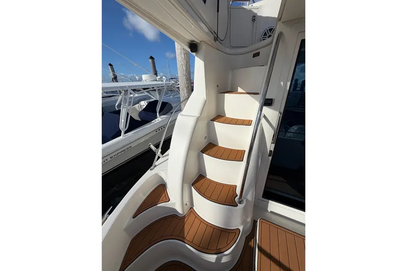 Slide: The Image of Staircase on a 2006 Meridian 341 Sedan yacht with wooden steps and sleek design. - 15