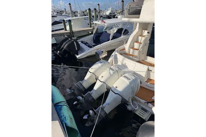 Slide: The Image of 2006 Meridian 341 Sedan yacht docked with powerful outboard engines. - 16