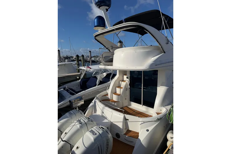 Slide: The Image of 2006 Meridian 341 Sedan yacht docked at marina under clear blue sky. - 17