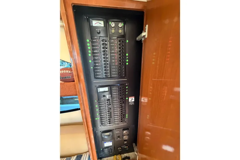 Slide: The Image of Electrical panel inside a 2006 Meridian 341 Sedan yacht, featuring switches and indicators. - 18