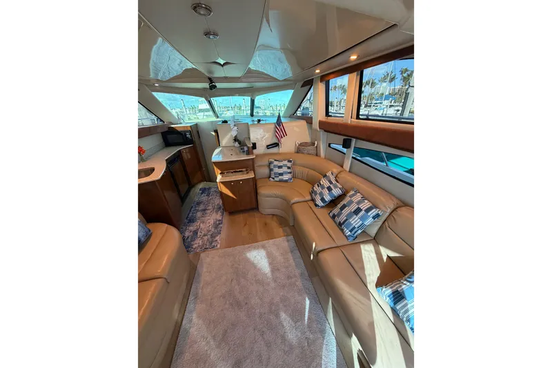 Slide: The Image of Luxurious interior of a 2006 Meridian 341 Sedan yacht with plush seating and elegant decor. - 19