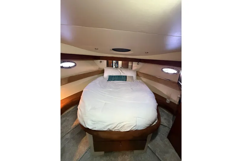 Slide: The Image of Luxurious bedroom interior of a 2006 Meridian 341 Sedan yacht with cozy bedding. - 22