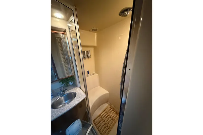 Slide: The Image of Compact bathroom in 2006 Meridian 341 Sedan yacht with shower and sink. - 23