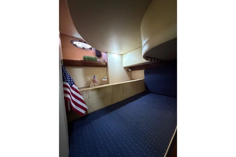 Slide: The Image of 2006 Meridian 341 Sedan cabin interior with American flag and cozy seating area. - 25