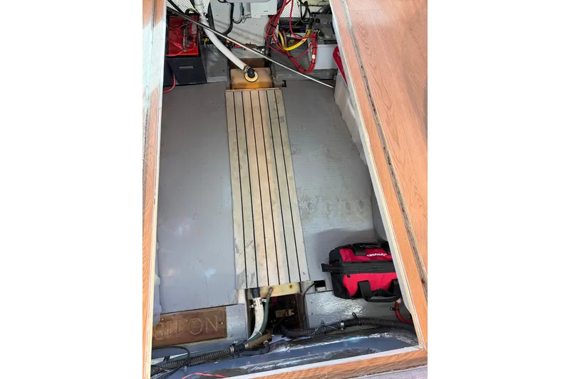 Slide: The Image of Engine compartment of a 2006 Meridian 341 Sedan boat, showing wiring and equipment. - 26