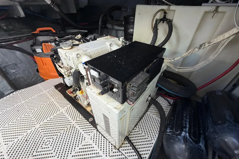 Slide: The Image of Engine room of a 2006 Meridian 341 Sedan, showcasing mechanical components and wiring. - 28