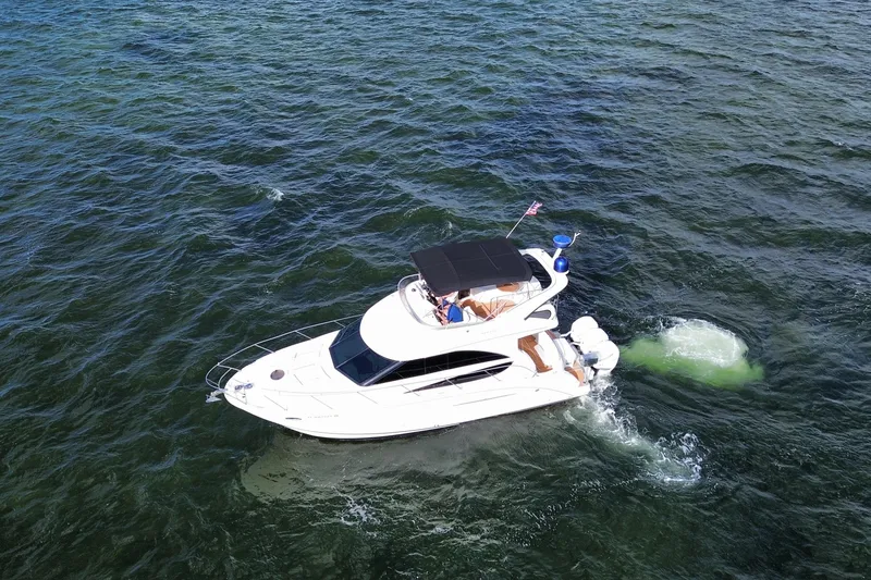 Slide: The Image of Aerial view of a 2006 Meridian 341 Sedan yacht cruising on open water. - 4