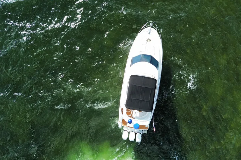 Slide: The Image of Aerial view of 2006 Meridian 341 Sedan yacht cruising on green water. - 5