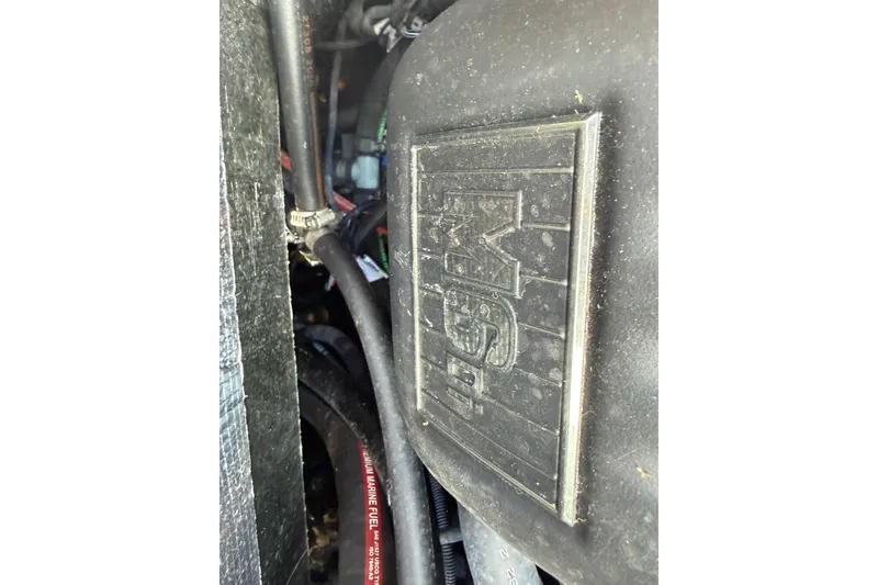 Slide: The Image of Close-up of 2021 Malibu M220 engine compartment with visible wiring and components. - 11