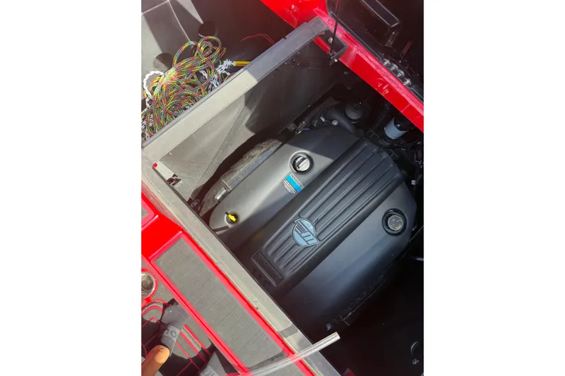 Slide: The Image of 2021 Malibu M220 engine compartment with visible wiring and components. - 12