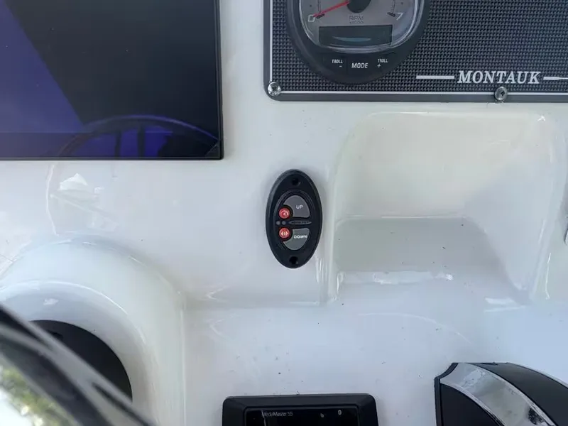 Slide: The Image of Dashboard of 2024 Boston Whaler 17 Montauk with controls. - 11