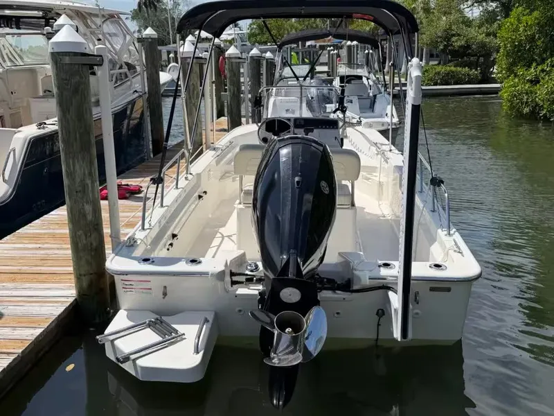 Slide: The Image of 2024 Boston Whaler 17 Montauk docked, rear view. - 3